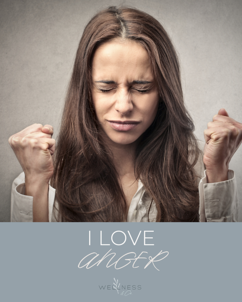 Image of a woman balling up her firsts and closing her eyes with text that says "I love anger"